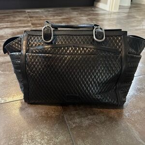 Authentic Christian Louboutin black leather handbag